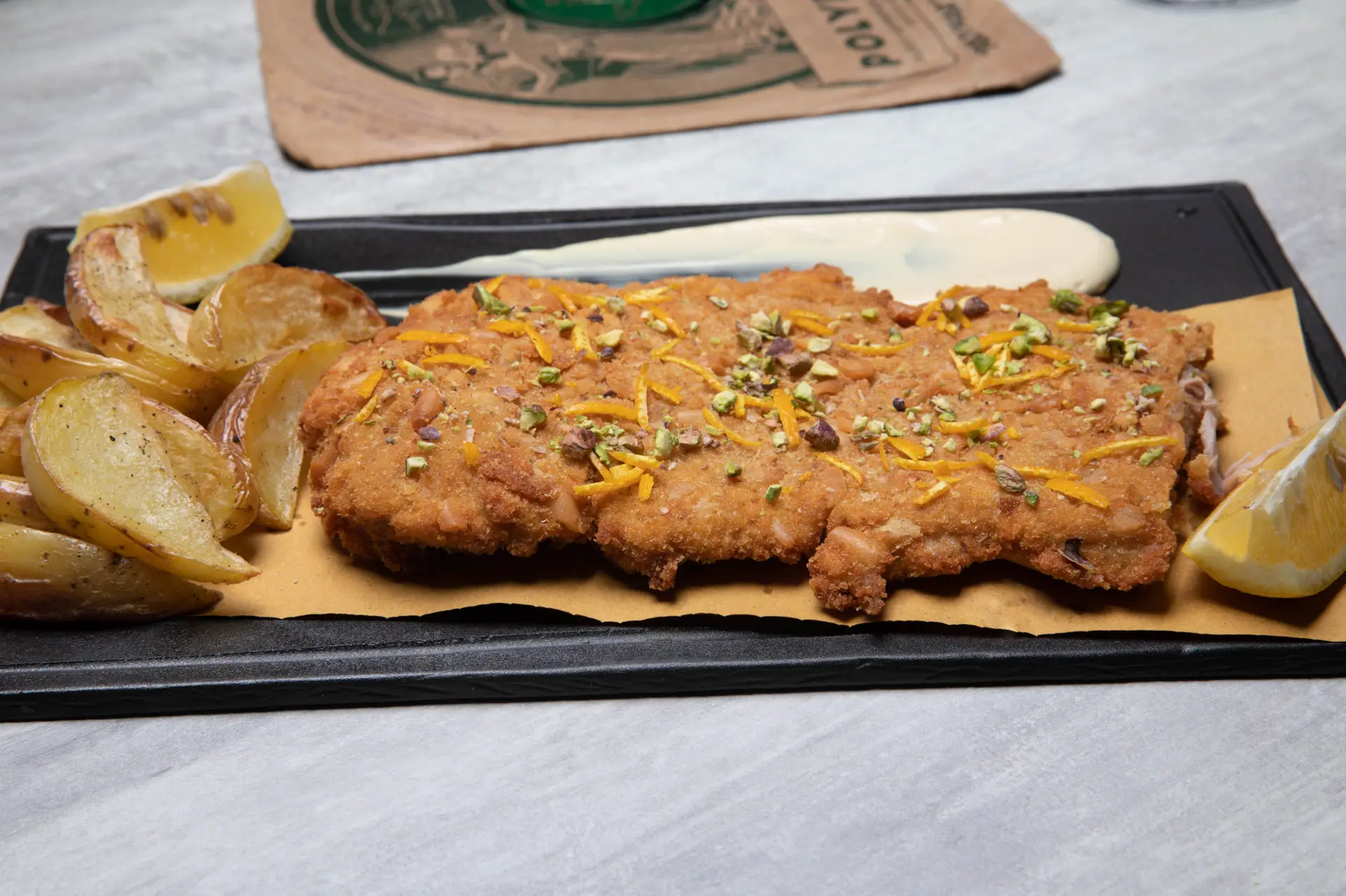 Cotoletta in Doppia Panatura con Granella di Pistacchi e Arance